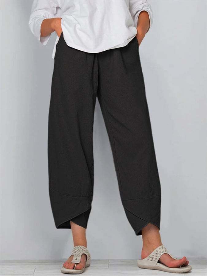 Avelina relaxed chic pants with a mid-rise waist and flowing silhouette, shown in neutral tones
