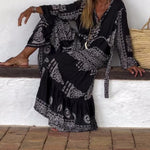 Emy black V-neck dress with elegant bell sleeves and soft flowy drape