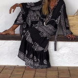 Emy black V-neck dress with elegant bell sleeves and soft flowy drape
