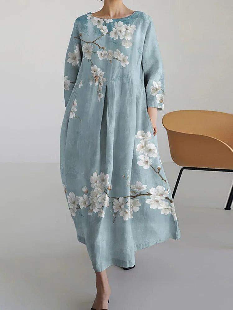 Cherie light blue A-line maxi dress with 3/4 sleeves and flowing floor-length skirt