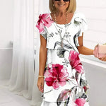 Jenna cascading floral tiered dress with flowing skirt in a soft feminine print