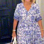 Keisha graceful V-neck floral dress shown in a soft feminine silhouette