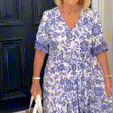Keisha graceful V-neck floral dress shown in a soft feminine silhouette
