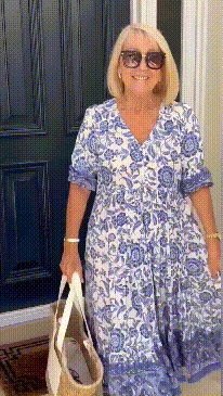 Keisha graceful V-neck floral dress shown in a soft feminine silhouette