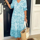 Keisha graceful V-neck floral dress shown in a soft feminine silhouette
