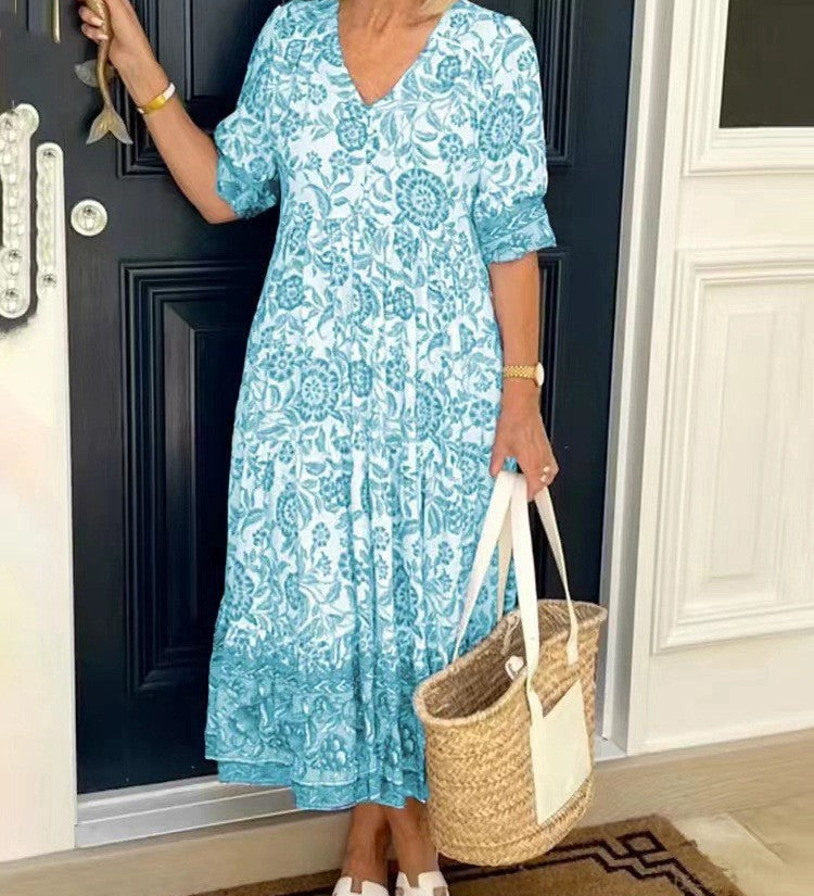 Keisha graceful V-neck floral dress shown in a soft feminine silhouette
