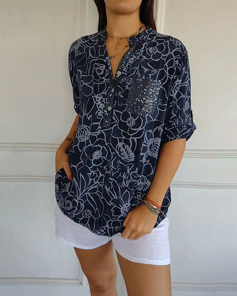 Sade floral print blouse with a relaxed, flowing silhouette in light blue