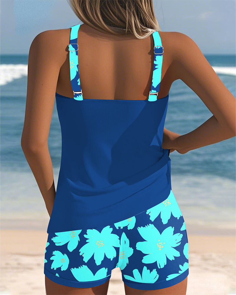 Edith sleeveless printed tankini with U-neck and open back in navy, orange and blue