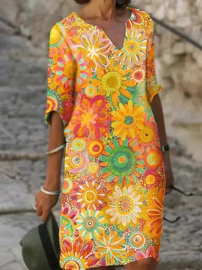 Nira vibrant floral midi dress with a flowy silhouette and colourful print