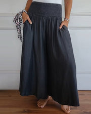 Sage flowy high-waist wide-leg pants shown in a relaxed, flattering silhouette