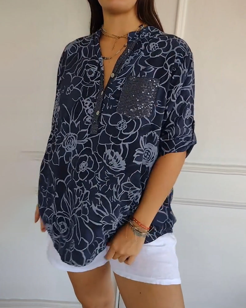 Sade floral print blouse with a relaxed, flowing silhouette in light blue