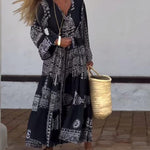 Emy black V-neck dress with elegant bell sleeves and soft flowy drape