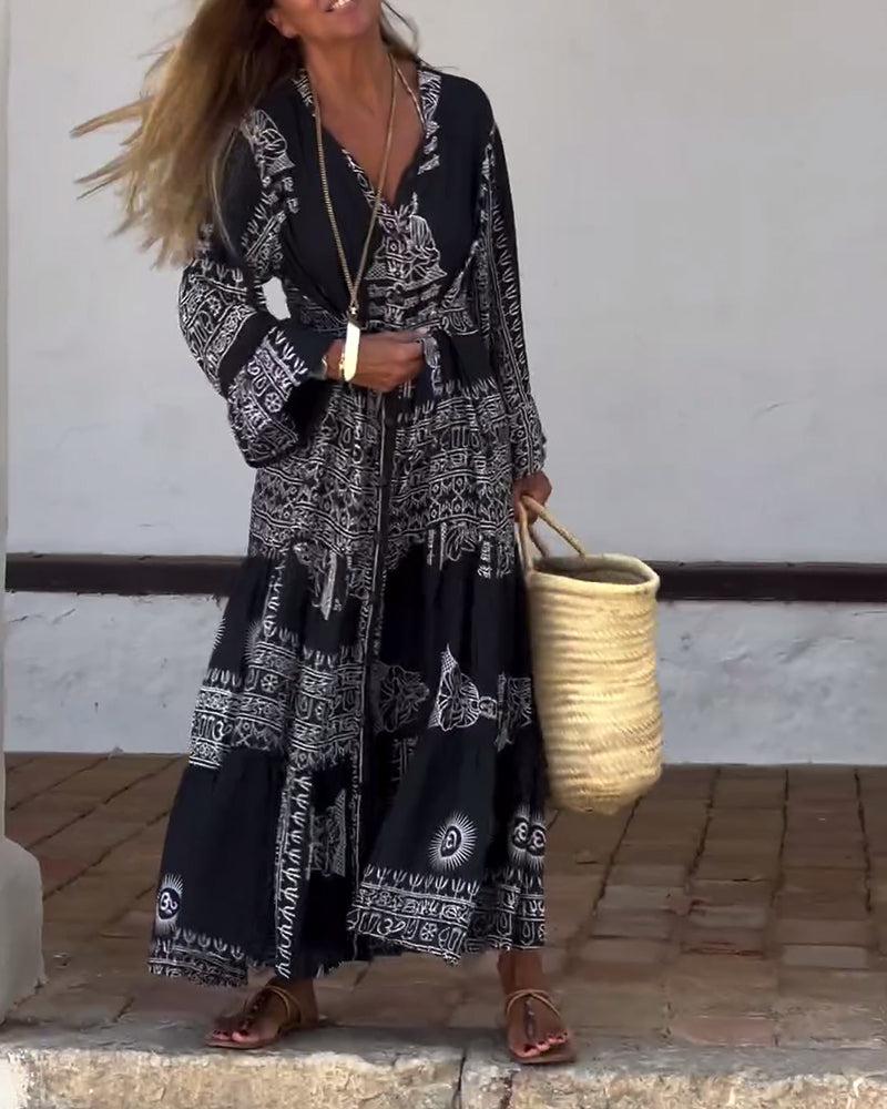 Emy black V-neck dress with elegant bell sleeves and soft flowy drape