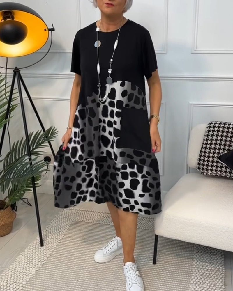 Cassandra women's elegant relaxed-fit midi dress with deep side pockets in a black and stone print