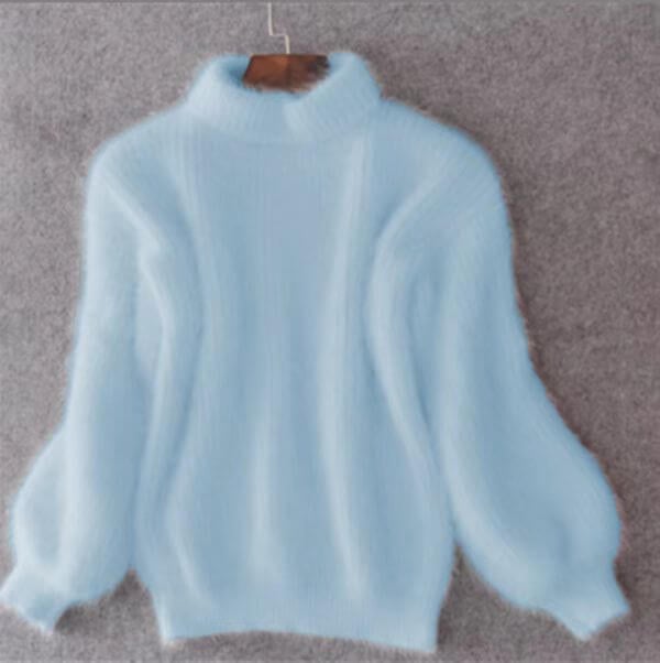 Lucia effortless soft sweater with a relaxed silhouette, shown in a neutral tone