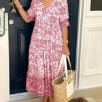 Keisha graceful V-neck floral dress shown in a soft feminine silhouette