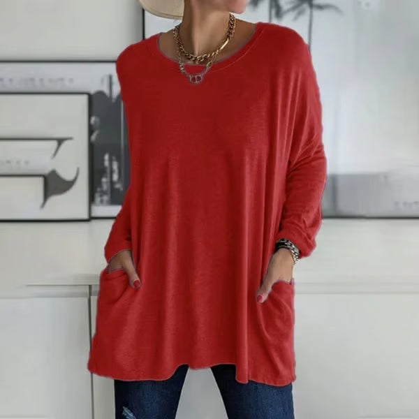 Alondra everyday pocket top with loose fit and flared hem, shown in a neutral colour