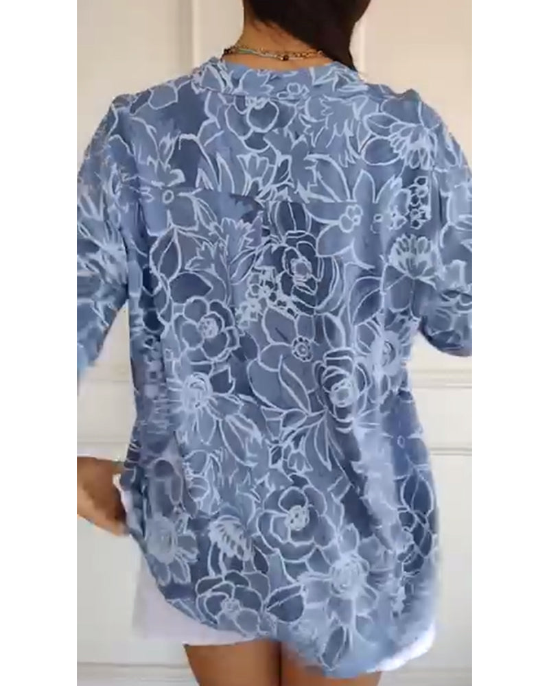 Sade floral print blouse with a relaxed, flowing silhouette in light blue