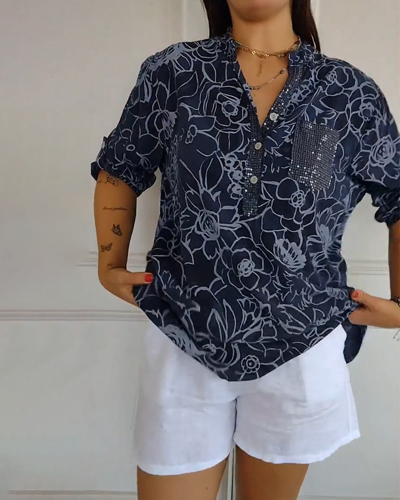 Sade floral print blouse with a relaxed, flowing silhouette in light blue