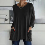 Alondra everyday pocket top with loose fit and flared hem, shown in a neutral colour