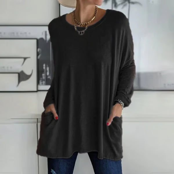 Alondra everyday pocket top with loose fit and flared hem, shown in a neutral colour