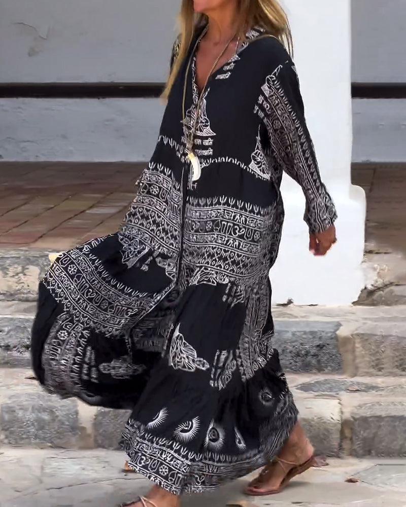 Emy black V-neck dress with elegant bell sleeves and soft flowy drape