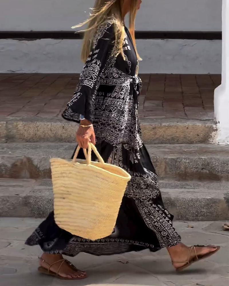 Emy black V-neck dress with elegant bell sleeves and soft flowy drape