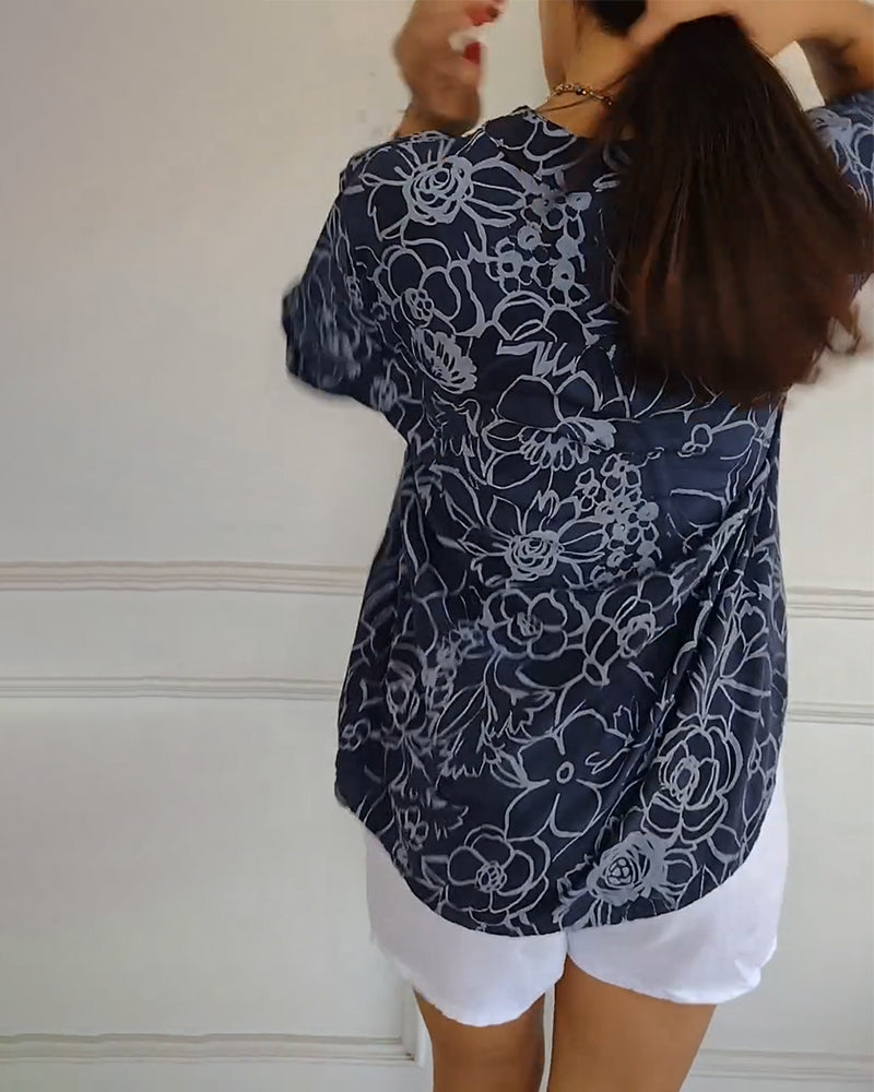 Sade floral print blouse with a relaxed, flowing silhouette in light blue