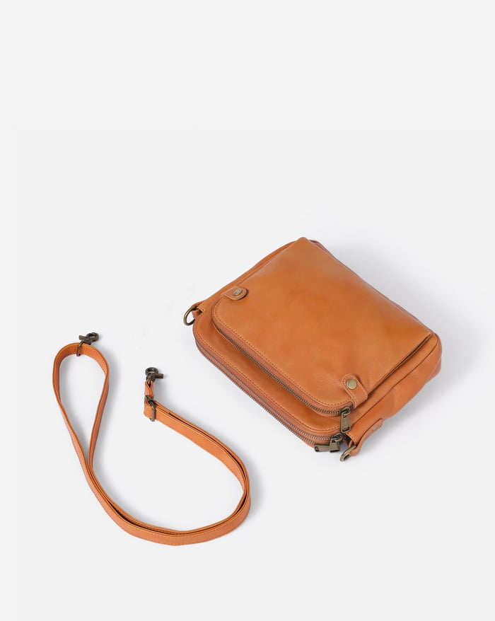 Kaya's Jewel full-grain leather shoulder bag shown in brown, blue, black and green