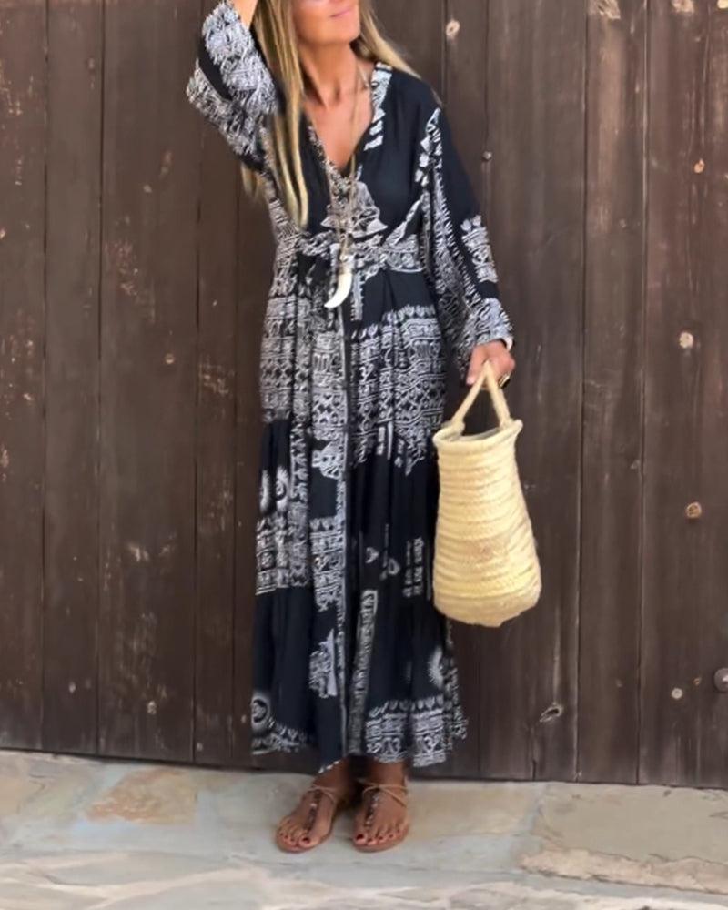 Emy black V-neck dress with elegant bell sleeves and soft flowy drape