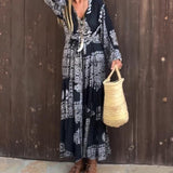 Emy black V-neck dress with elegant bell sleeves and soft flowy drape