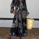 Emy black V-neck dress with elegant bell sleeves and soft flowy drape