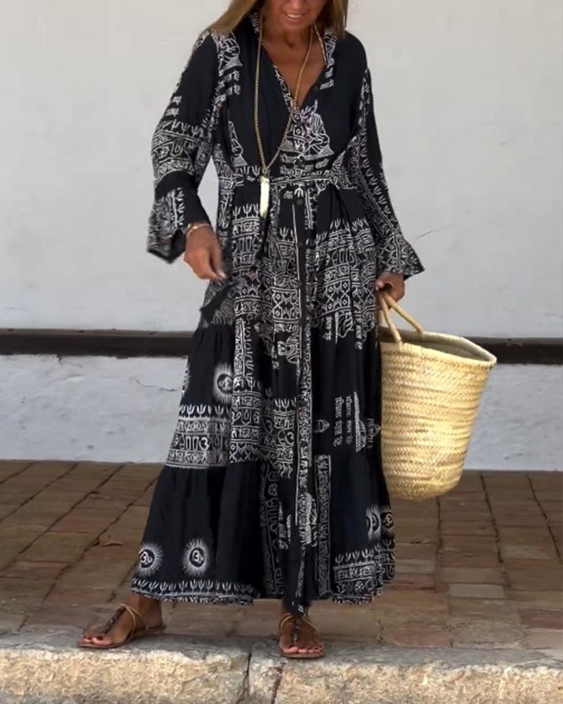 Emy black V-neck dress with elegant bell sleeves and soft flowy drape
