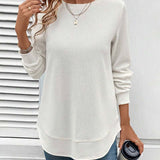 Ynes graceful long sleeve top with a classic round neck and regular fit