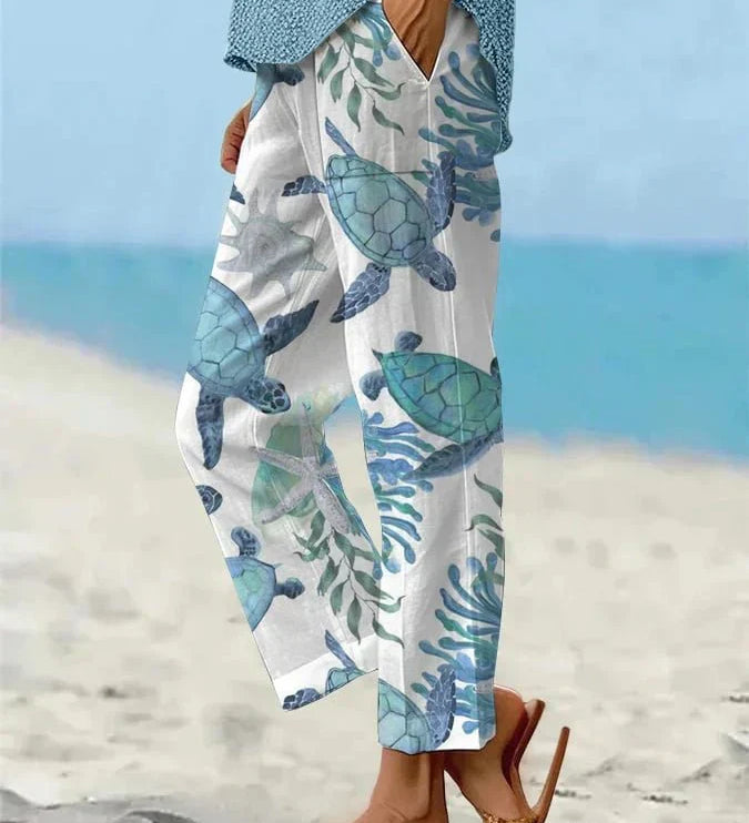 Sally relaxed casual pants with floral and turtle print in a light, easy-going colour