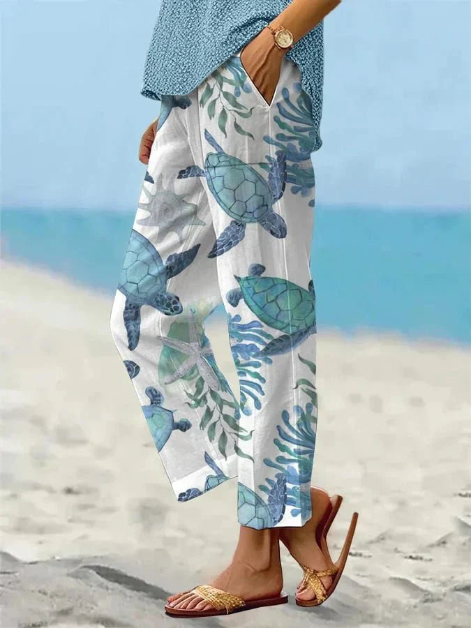Sally relaxed casual pants with floral and turtle print in a light, easy-going colour