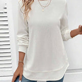 Ynes graceful long sleeve top with a classic round neck and regular fit