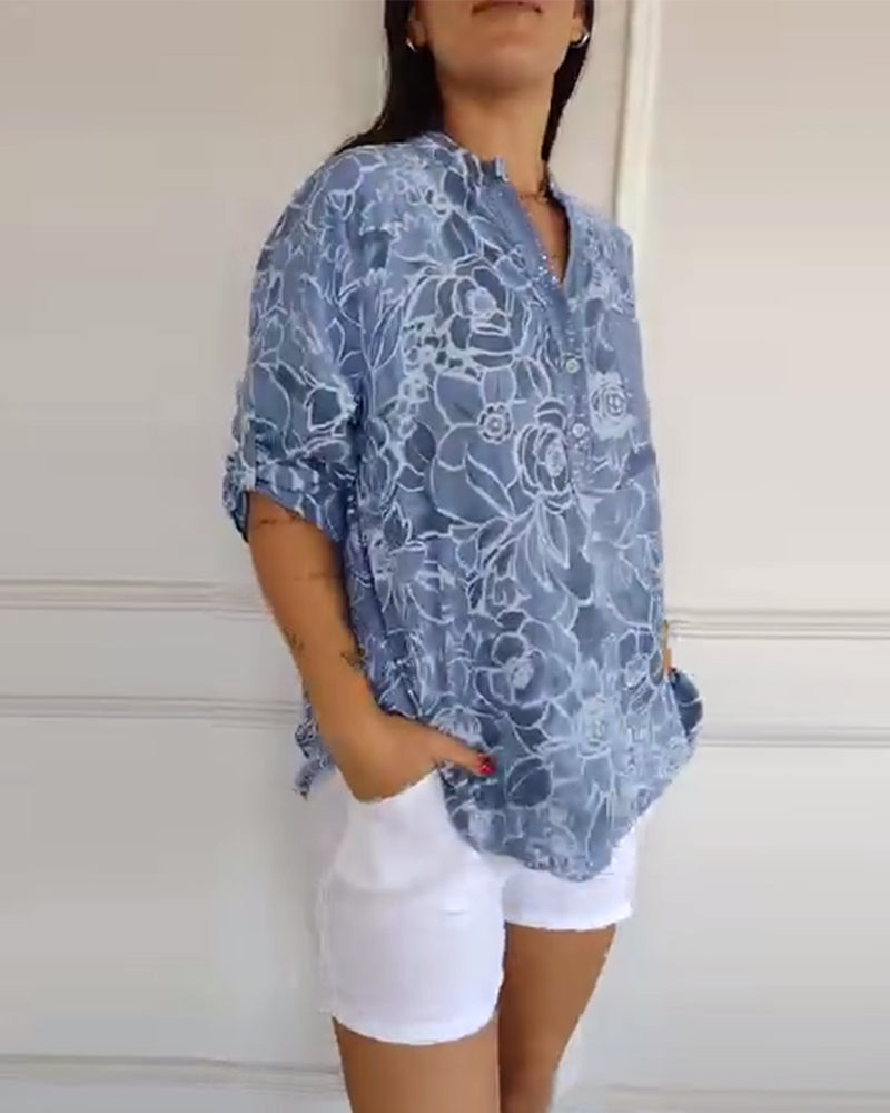 Sade floral print blouse with a relaxed, flowing silhouette in light blue
