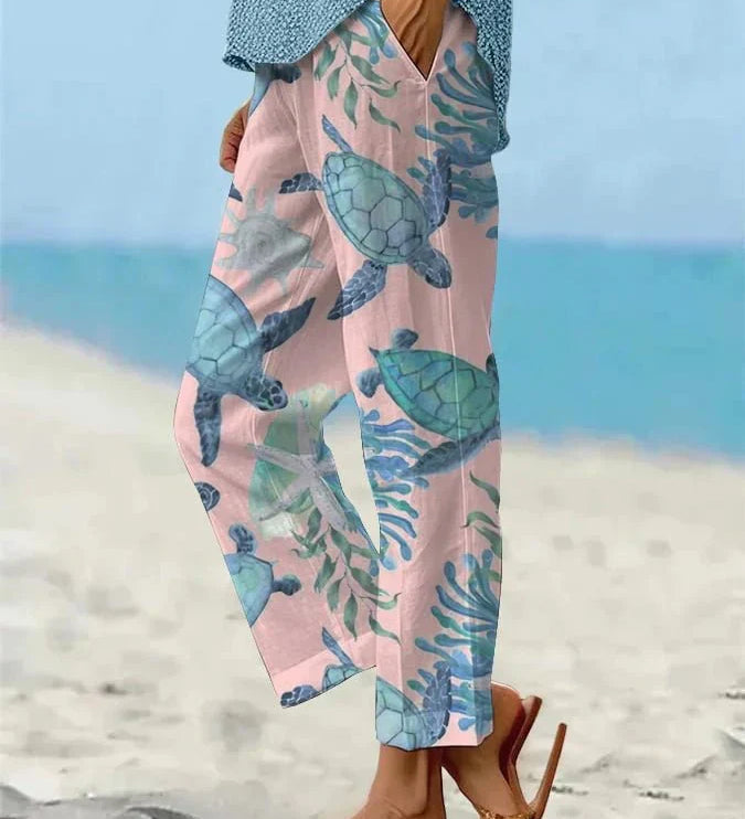 Sally relaxed casual pants with floral and turtle print in a light, easy-going colour
