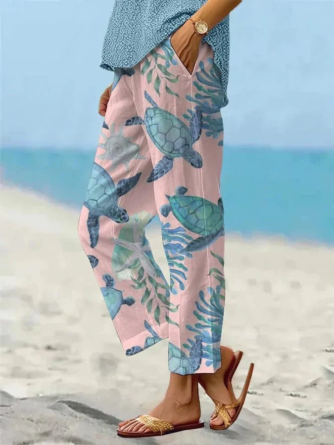 Sally relaxed casual pants with floral and turtle print in a light, easy-going colour