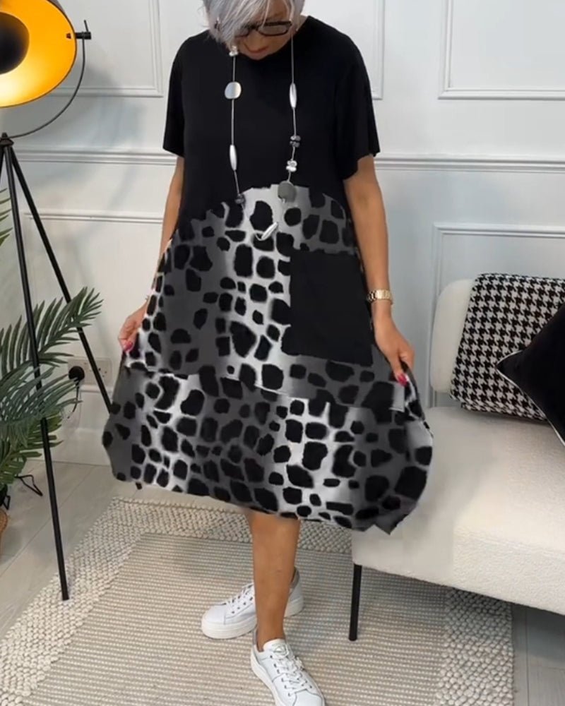 Cassandra women's elegant relaxed-fit midi dress with deep side pockets in a black and stone print