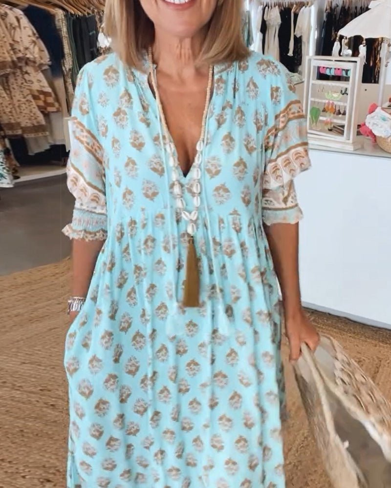 Mana floral v-neck dress shown in blue, green and pink