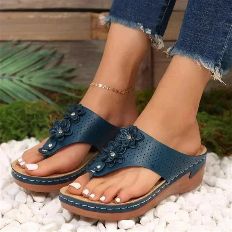 Nami orthopedic wedge sandals shown in white, blue, gold and black