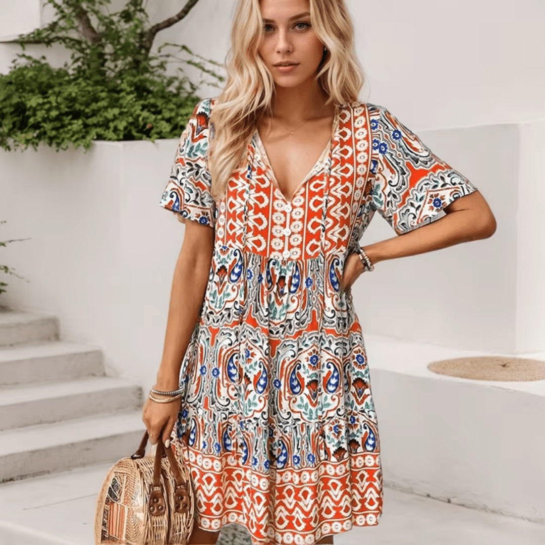 Abigail graceful midi dress shown in orange, available in pink and blue