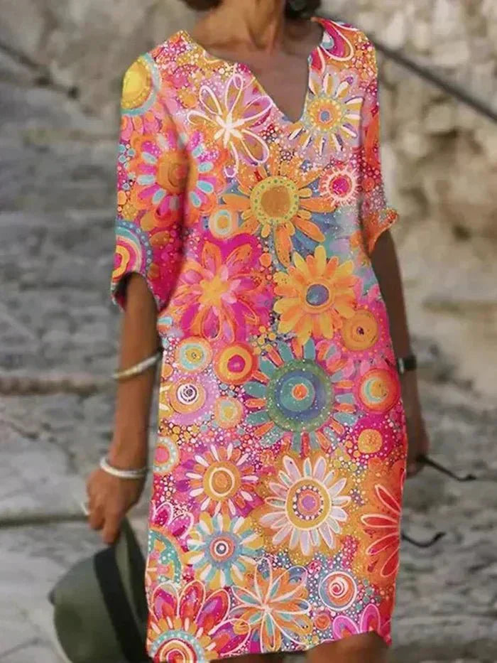 Nira vibrant floral midi dress with a flowy silhouette and colourful print