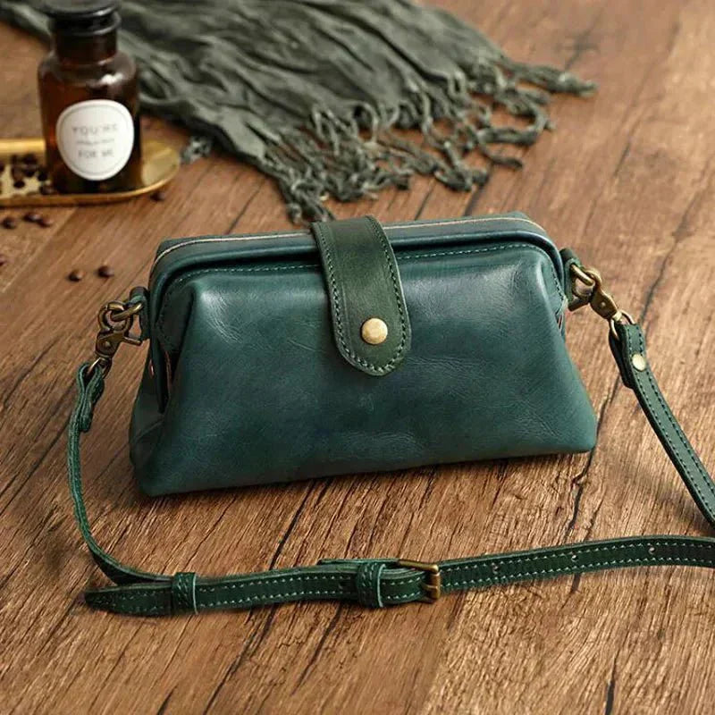 Eclipse Charm refined leather shoulder bag with vintage-inspired frame closure and copper clasp