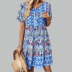 Abigail graceful midi dress shown in orange, available in pink and blue