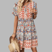 Abigail graceful midi dress shown in orange, available in pink and blue