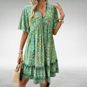 Bennett boho swing dress with v-neckline, empire waist and vibrant print
