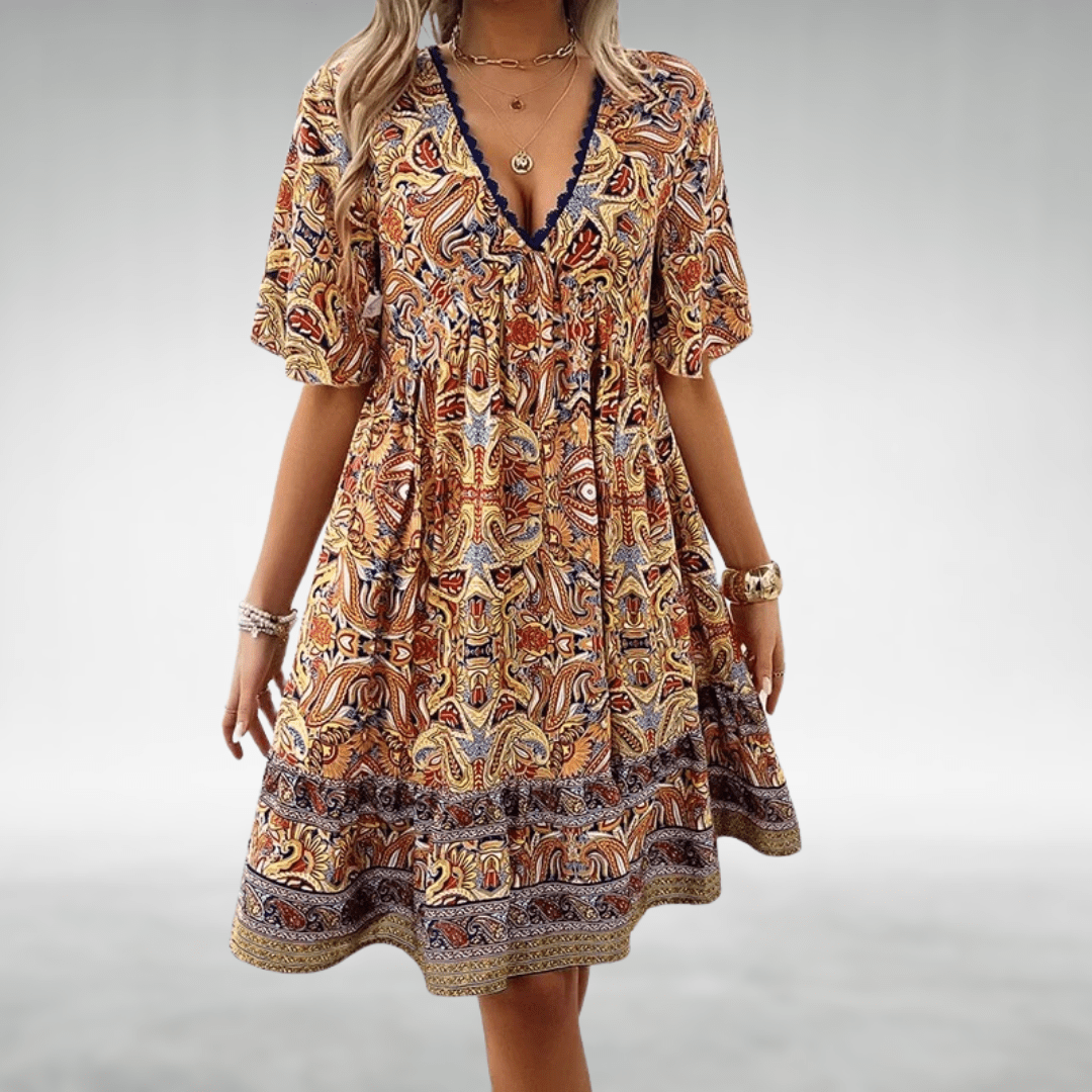 Bennett boho swing dress with v-neckline, empire waist and vibrant print